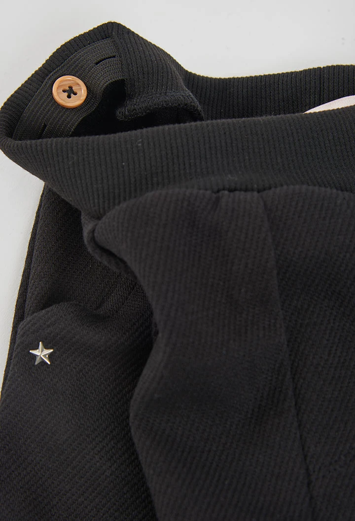 Pantalón punto niña negro con estrellas
