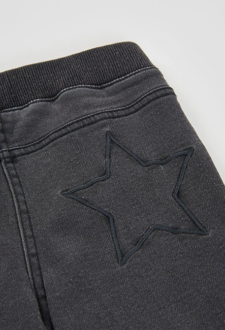 Pantalón denim niña negro con estrellas