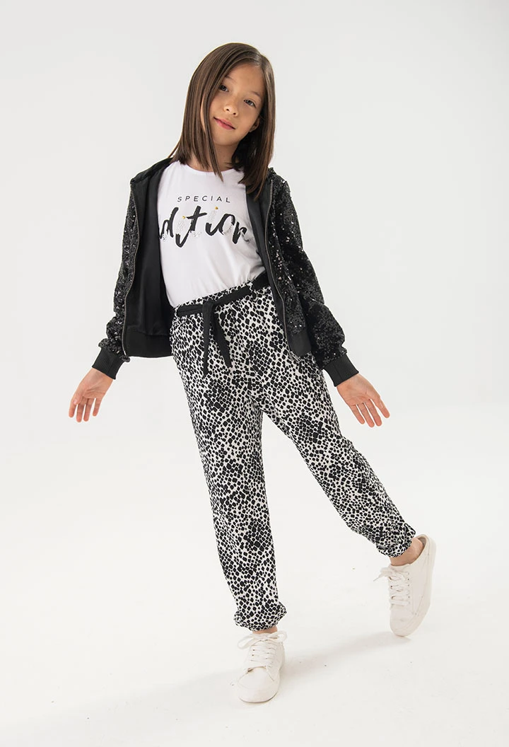 Calças de malha para menina com estampado em preto e branco
