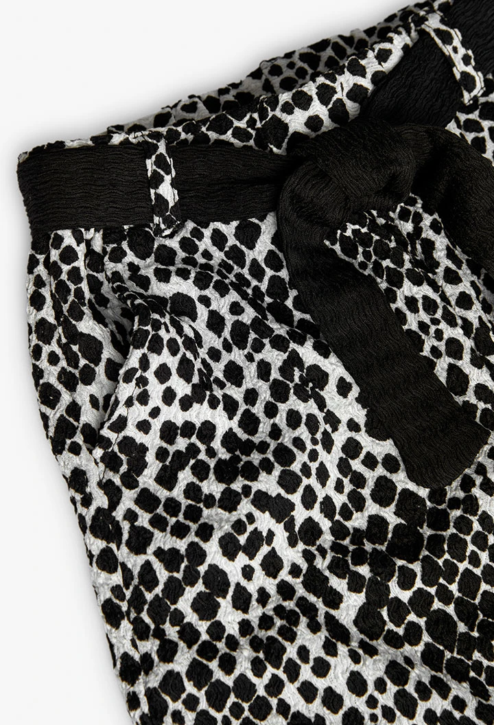 Calças de malha para menina com estampado em preto e branco