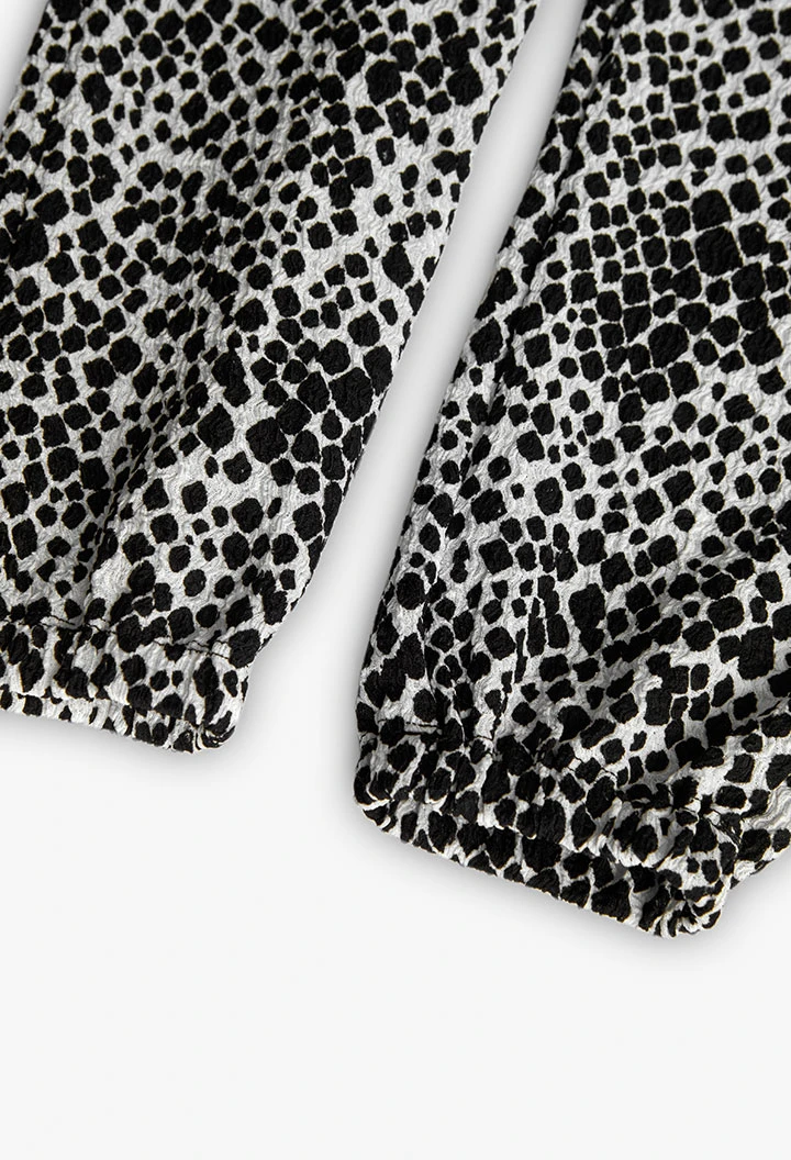 Calças de malha para menina com estampado em preto e branco