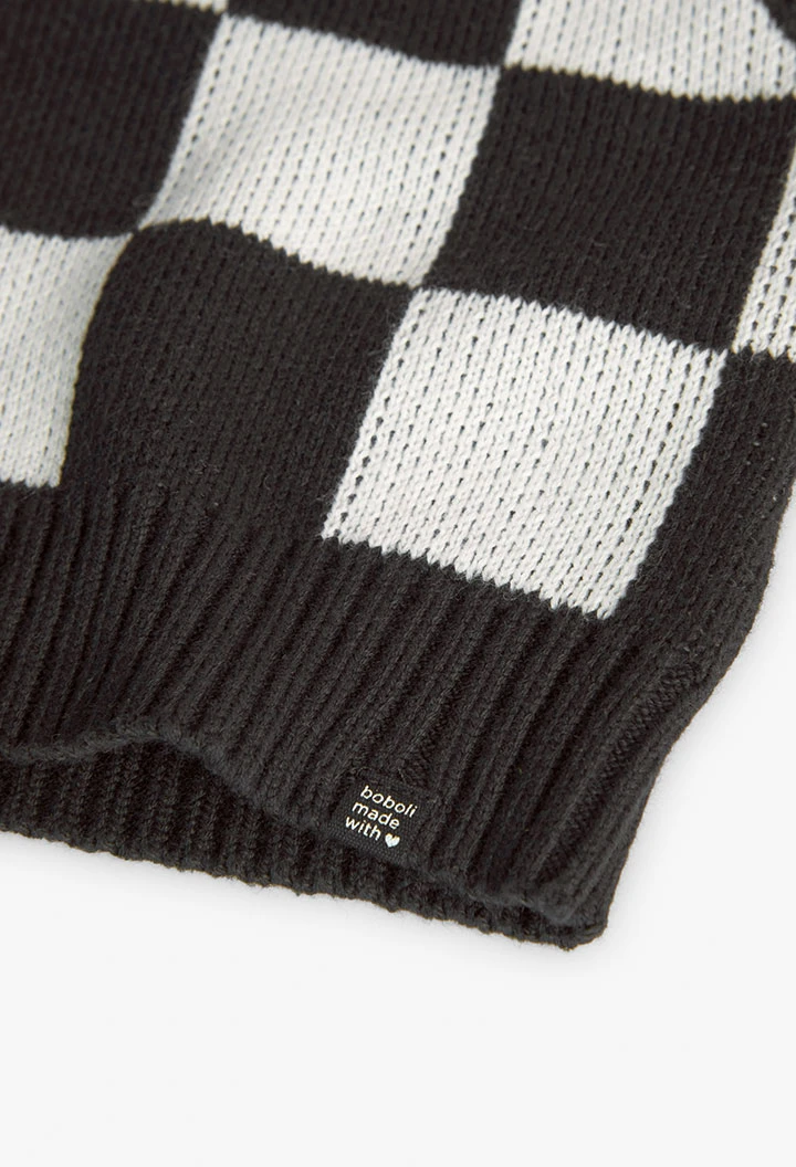 Knitted vest for girls with black and white check pattern