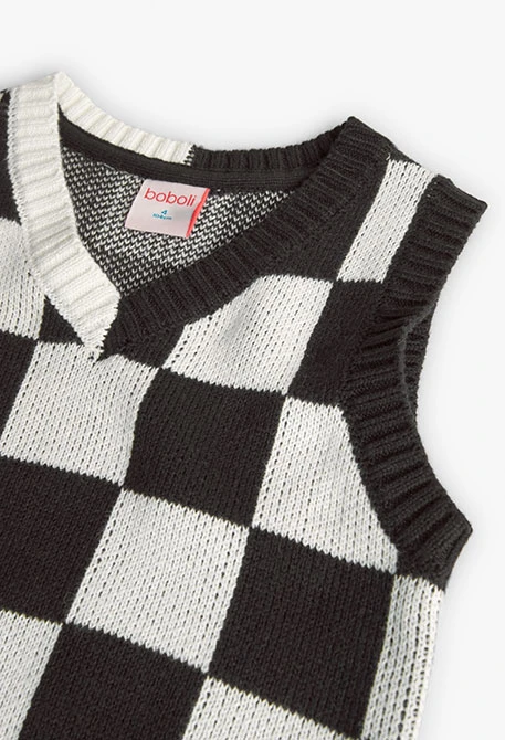 Knitted vest for girls with black and white check pattern