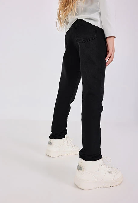 Pantalón tejano elástico de niña en color negro
