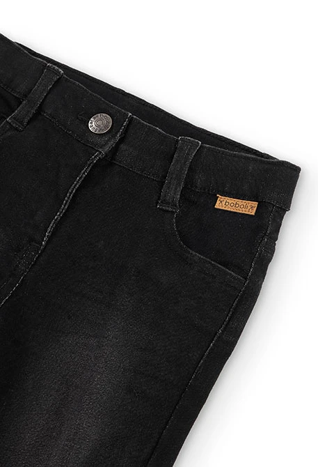 Pantalón tejano elástico de niña en color negro