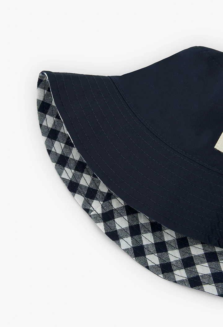 Bonnet réversible à carreaux