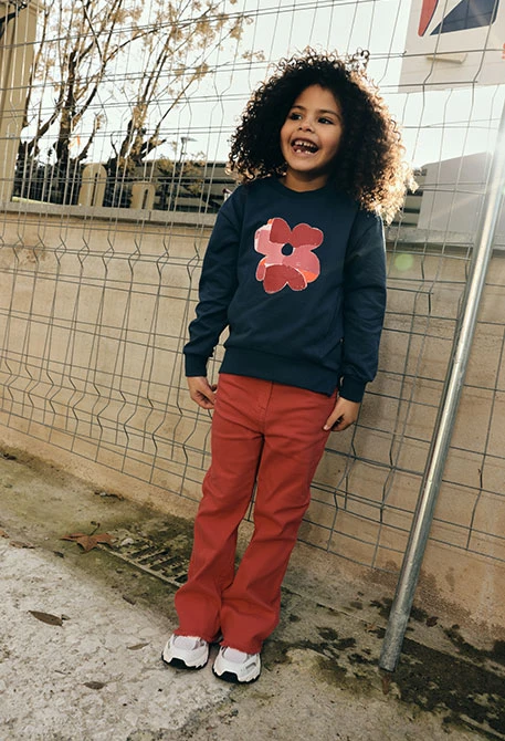 Girls’ strawberry-colored cotton trousers