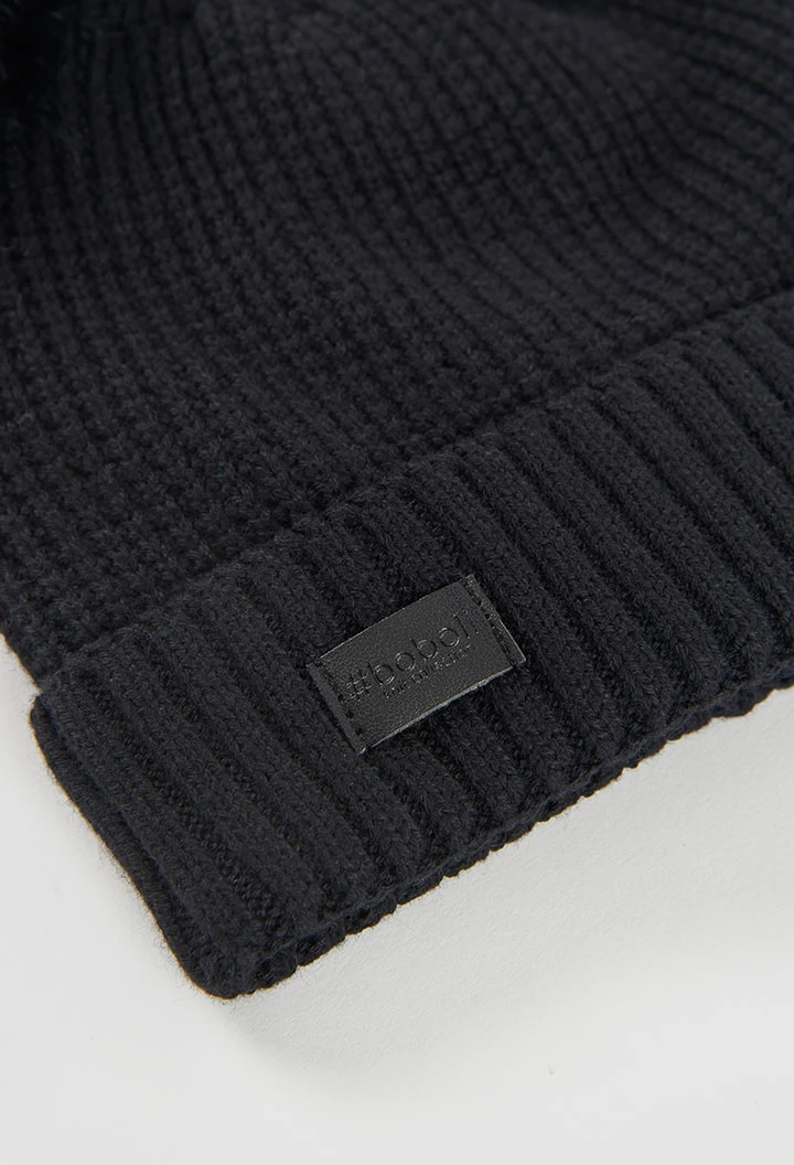 Black hat with pompoms