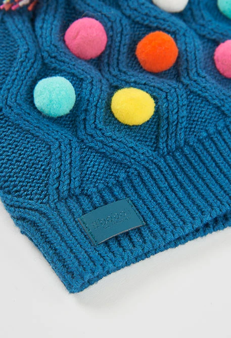 Green hat with coloured polka dots
