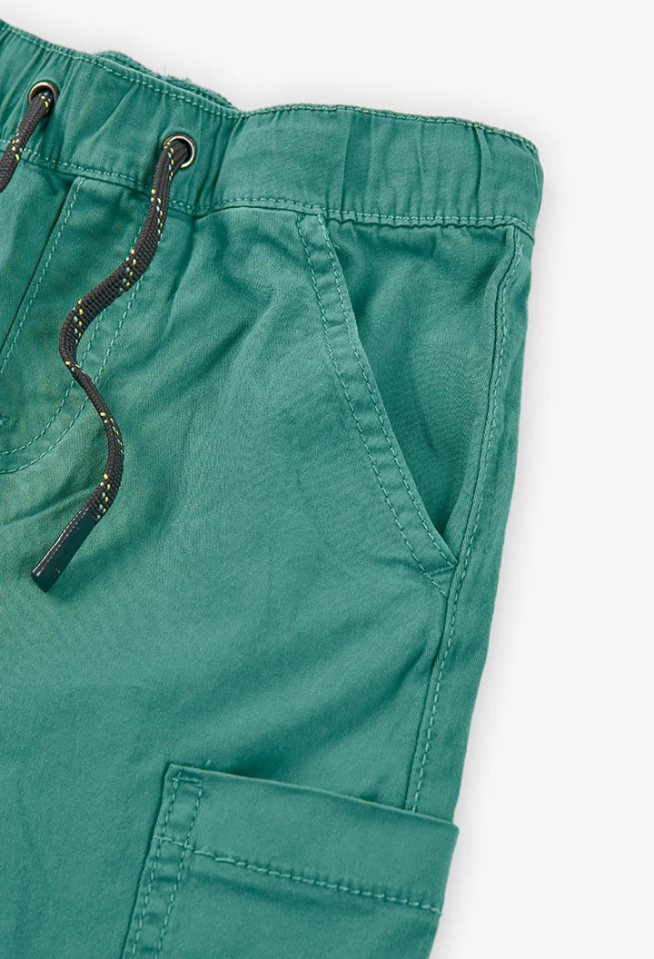 Elastic cargo trousers for boys in green colour