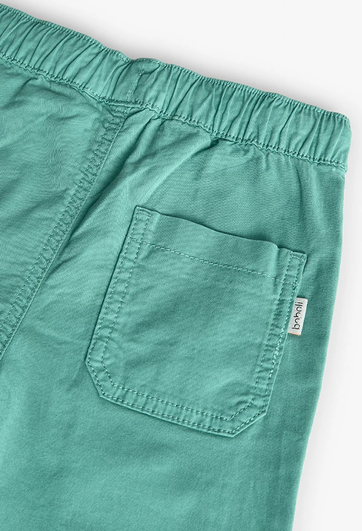 Elastic cargo trousers for boys in green colour