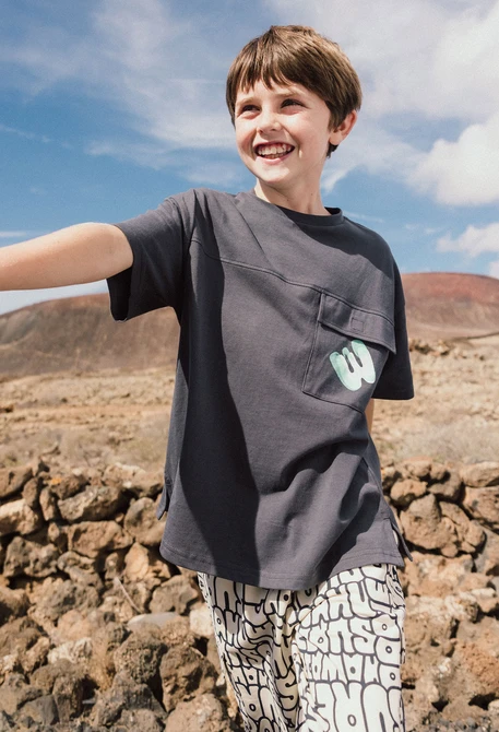 Bermuda in maglia per bambino con stampa in colore crema