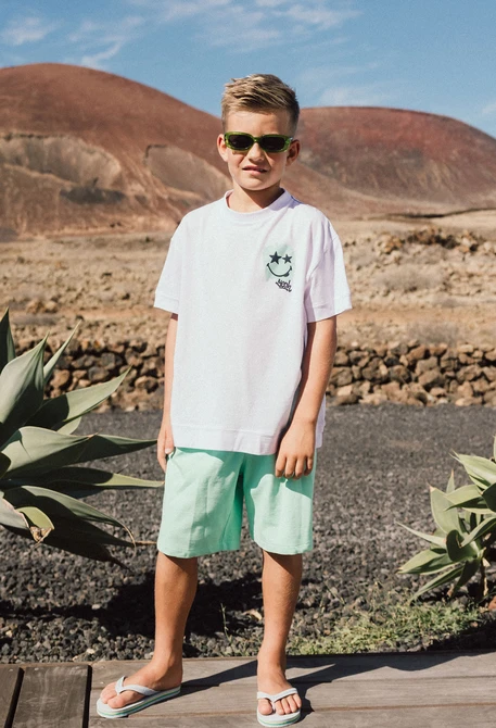 Bermuda in maglia per bambino di colore verde