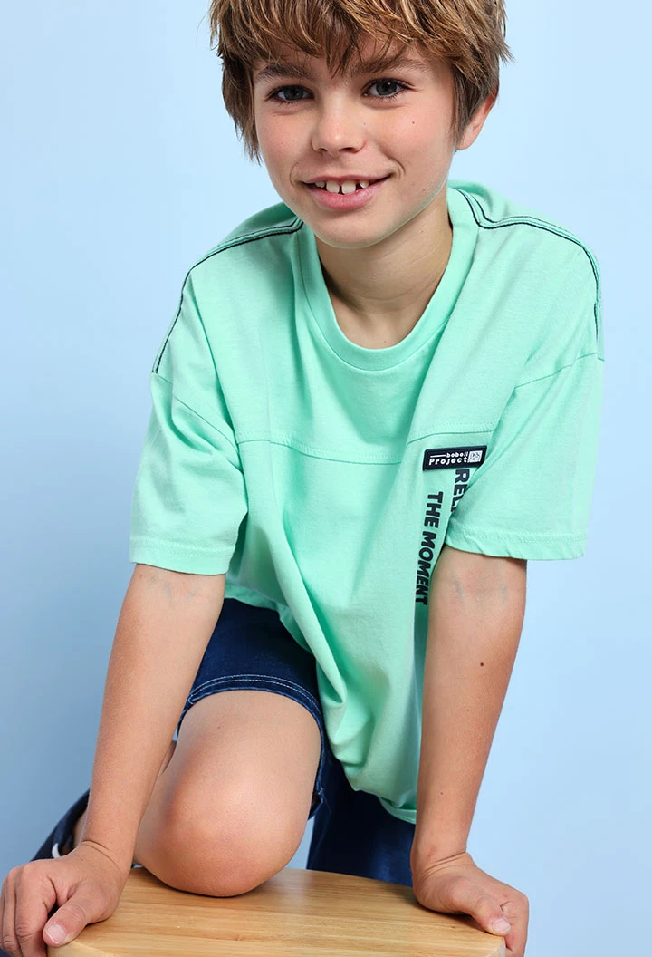 T-shirt per bambino in maglia di colore verde acqua