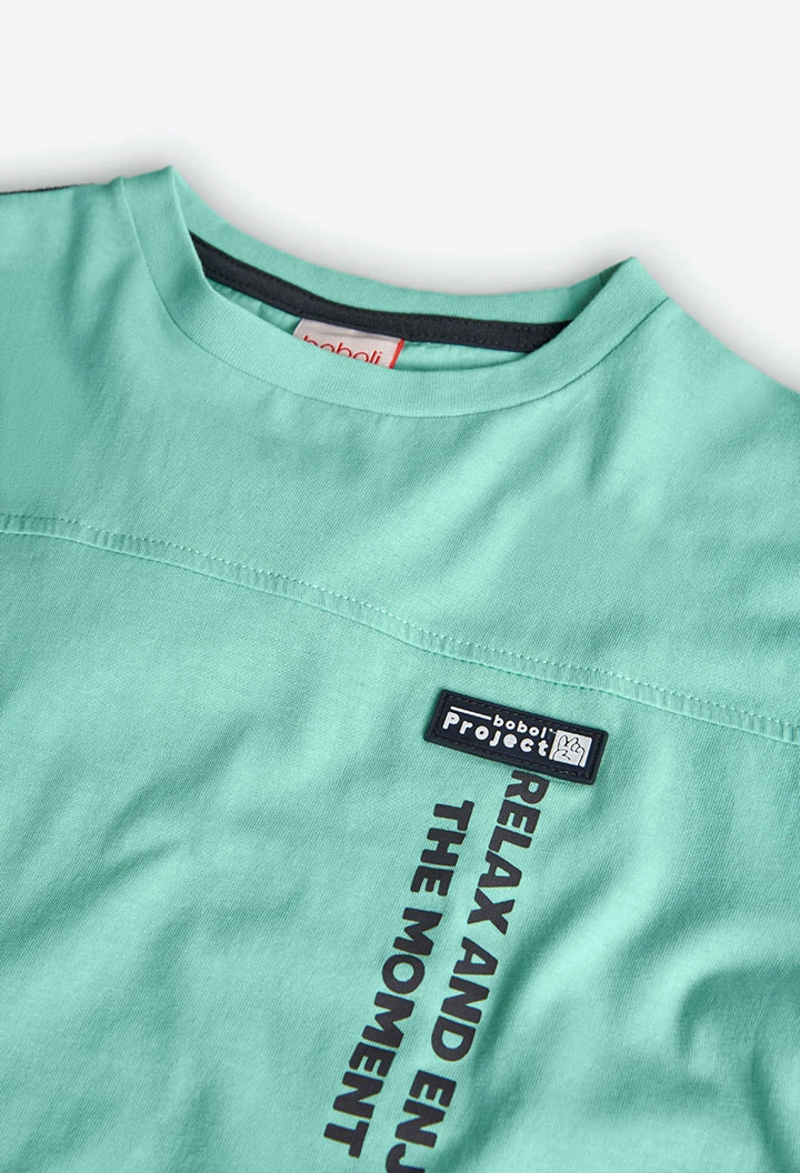 T-shirt per bambino in maglia di colore verde acqua