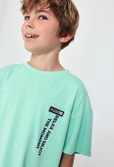 T-shirt per bambino in maglia di colore verde acqua