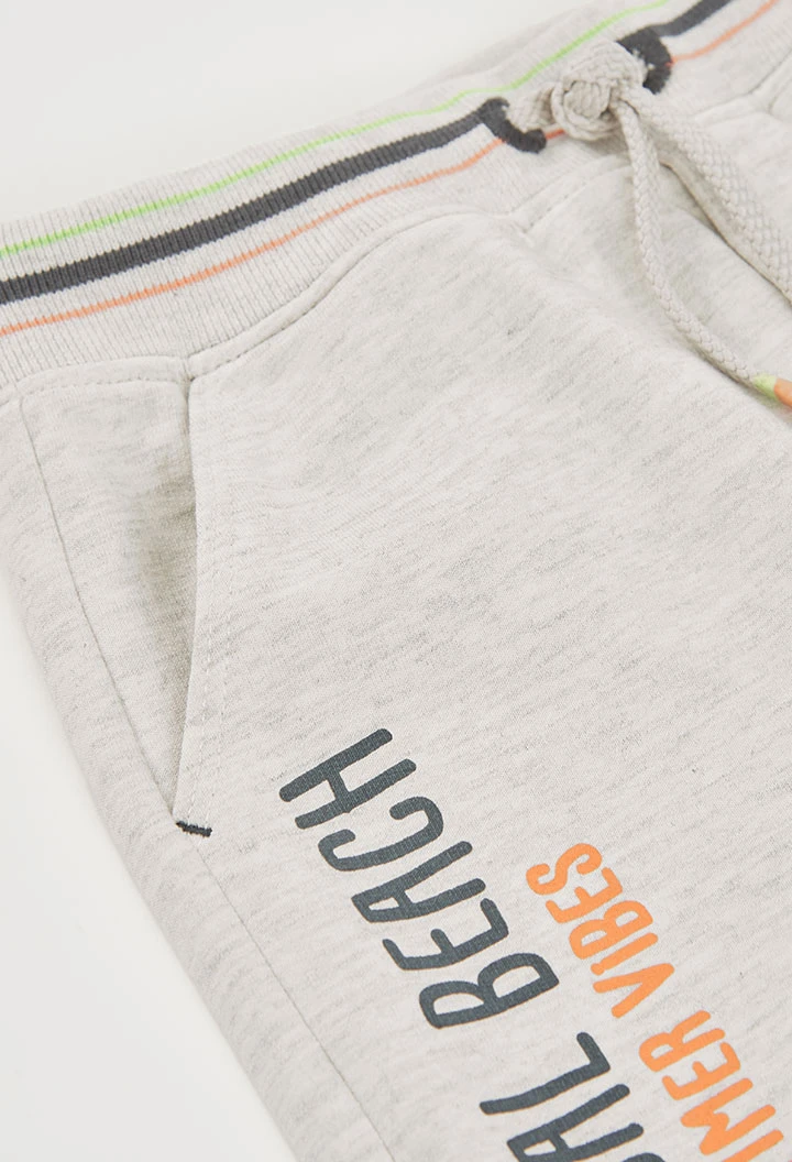 Bermudas malha cinza palmeiras