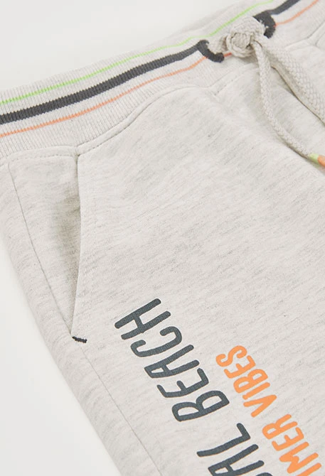 Bermuda in maglia grigia con palme