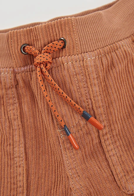 Pantaló de pana nen taronja amb butxaques