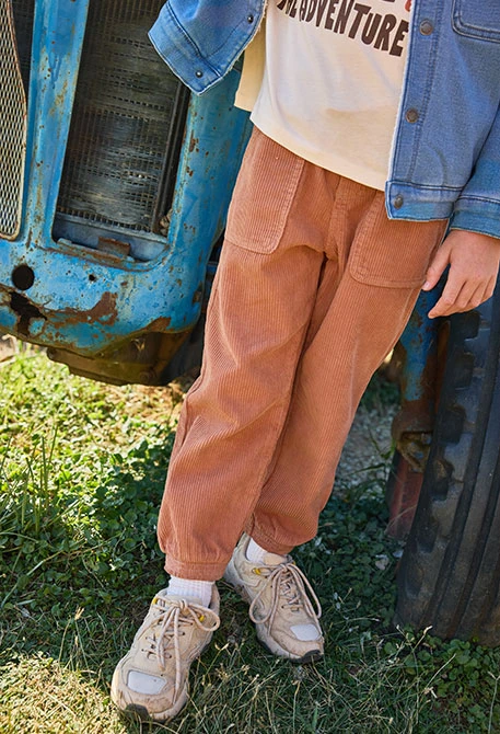 Boys\' orange corduroy trousers with pockets