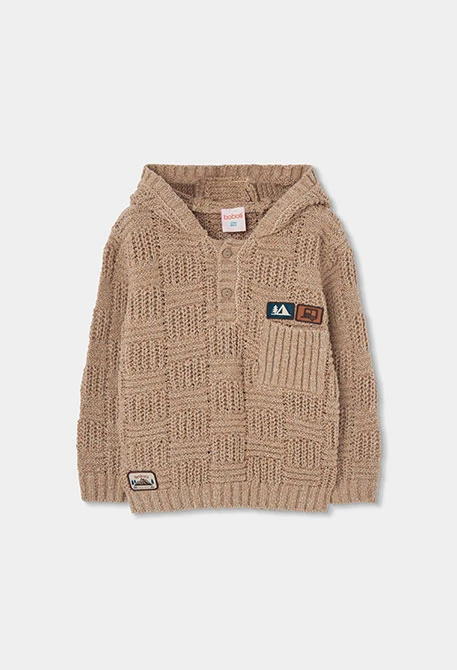 Jersei nen marró amb caputxa i pegats