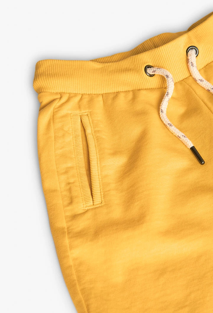 Bermuda in felpa per bambino di colore giallo