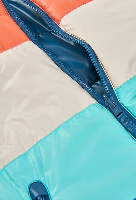 Armilla reversible nen teixit tècnic