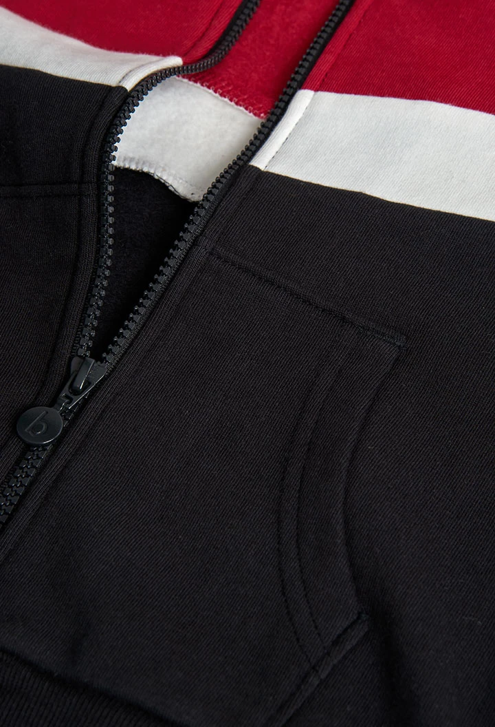 Boy´s jacket in black, red, and white fleece.