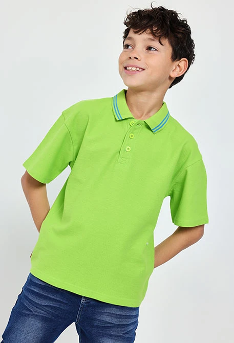 Boy\'s green piqué polo shirt