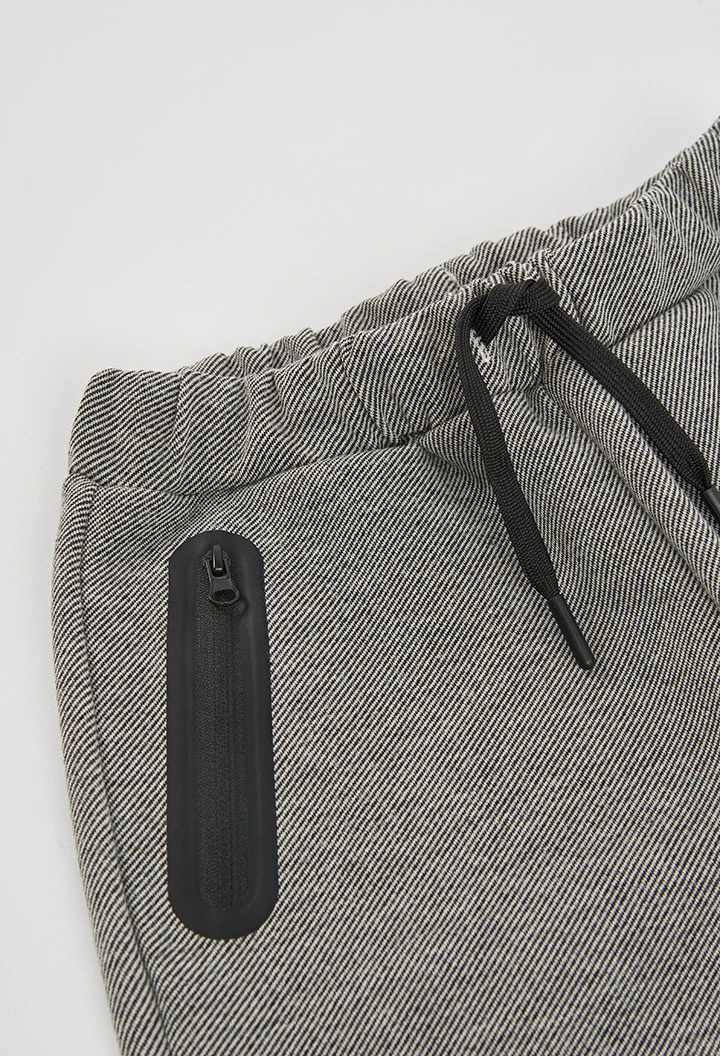 Pantalón punto negro niño con bolsillos cremallera