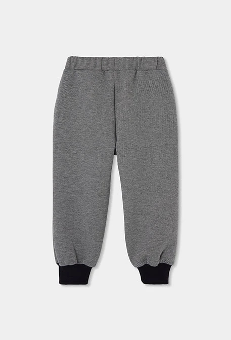 Black knitted trousers for boys with zip pockets