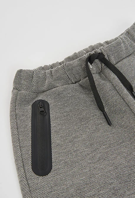 Pantalón punto negro niño con bolsillos cremallera