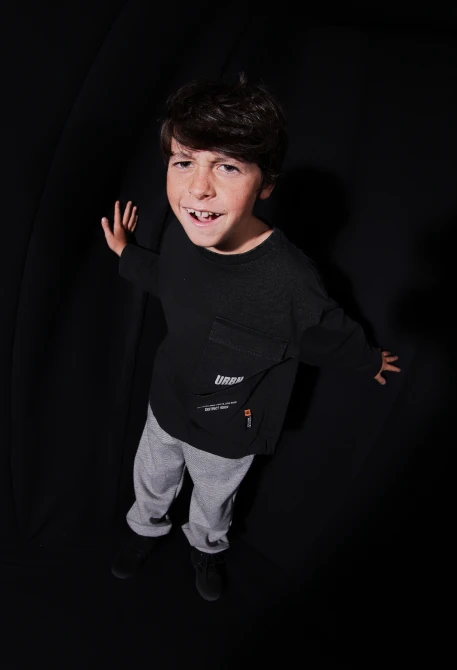 Black knitted trousers for boys with zip pockets