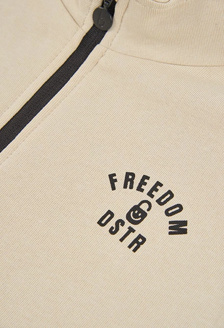 Conjunto punto niño beige estampado Freedom