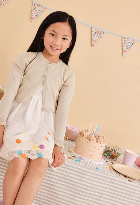 Giacca a maglia per neonata in colore beige