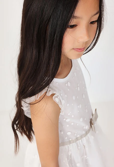 Baby girls tulle dress with a polka dot design in white colour
