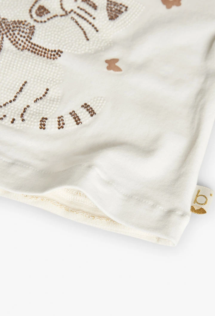 Maglietta di maglia per neonata in colore bianco.
