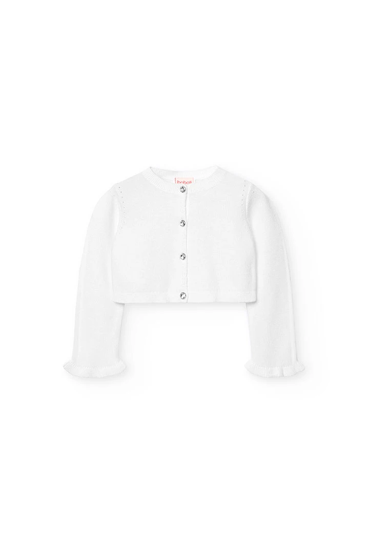 Veste en tricot pour bébé fille de couleur blanche.