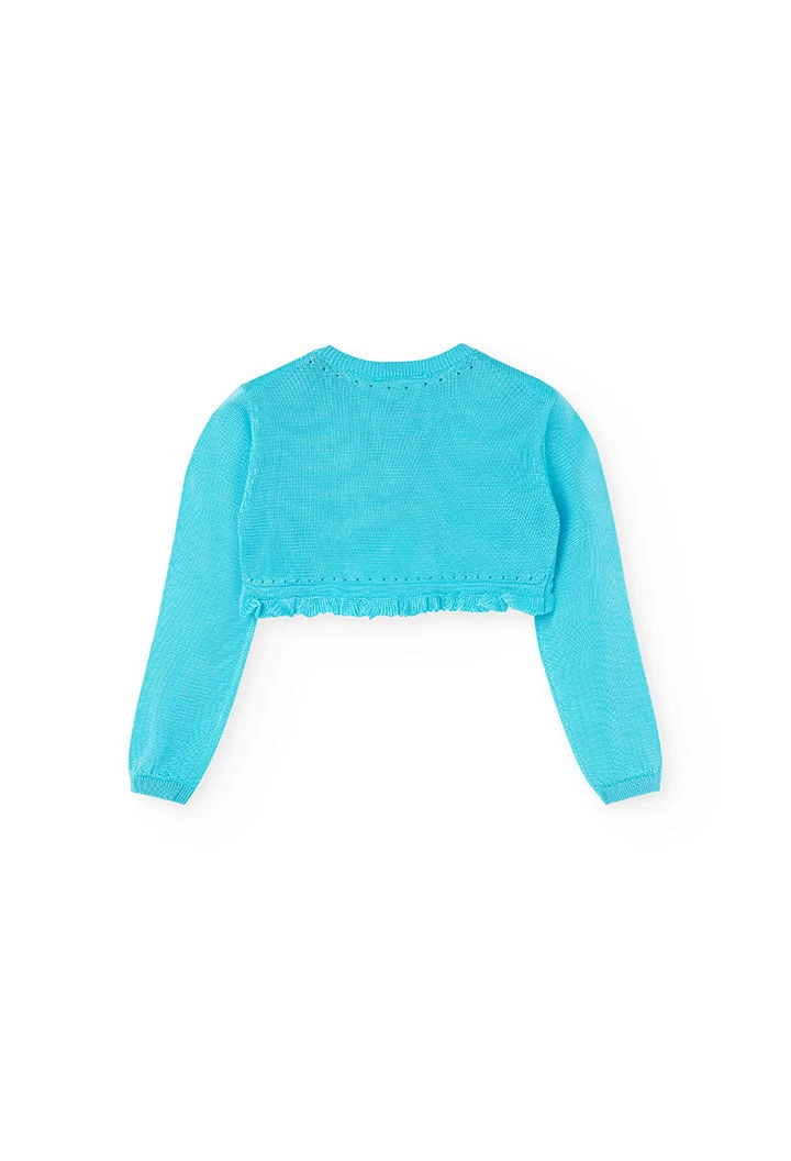 Boléro en tricot pour bébé fille de couleur bleue.
