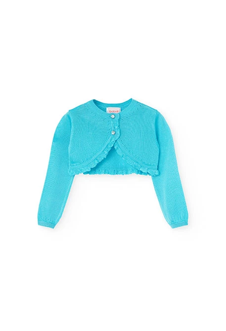 Boléro en tricot pour bébé fille de couleur bleue.