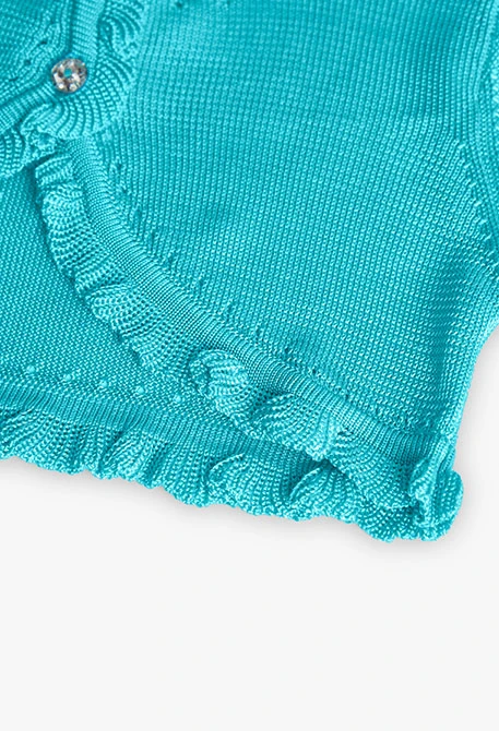 Boléro en tricot pour bébé fille de couleur bleue.