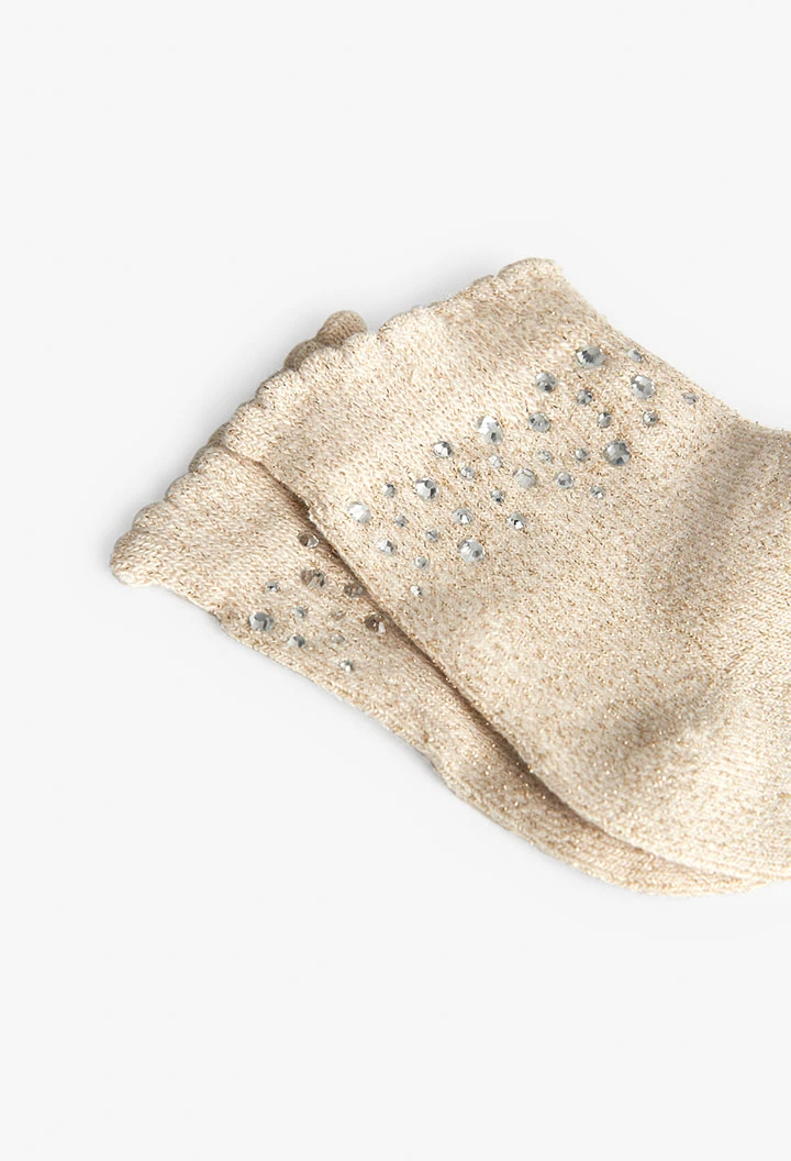 Pack of white knitted socks for baby