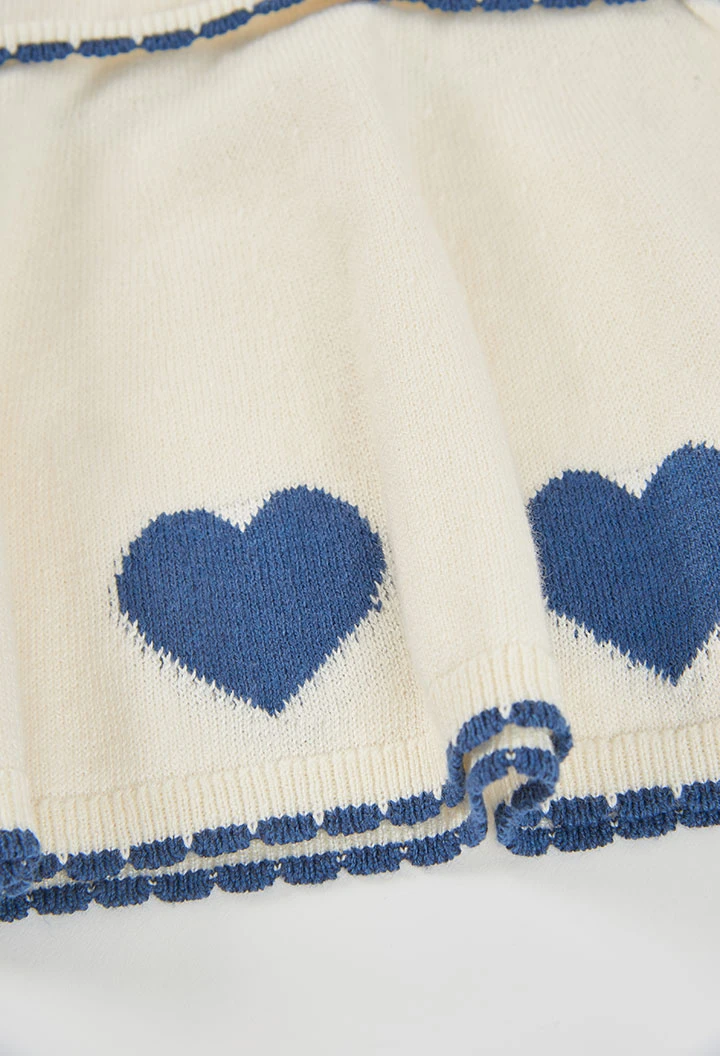 White knitted baby dress with blue hearts