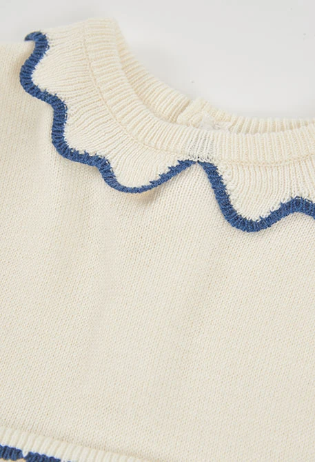 White knitted baby dress with blue hearts