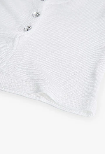 Chaqueta de tricotosa de bebé niña en blanco