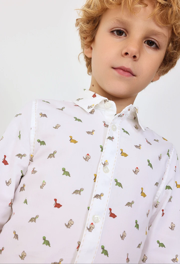 Camisa de popelín de bebé estampada en color blanco con motivo de dinosaurios