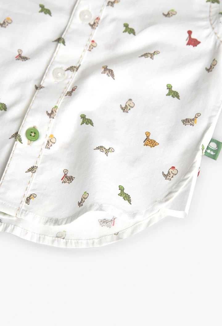 Chemise en popeline pour bébé imprimée de couleur blanche avec motif de dinosaures.
