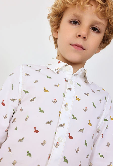 Camicia in popeline per bambini stampata in colore bianco con motivo di dinosauri