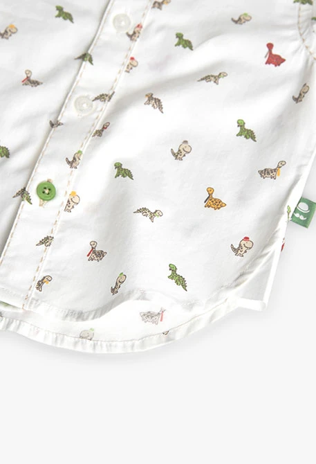Chemise en popeline pour bébé imprimée de couleur blanche avec motif de dinosaures.