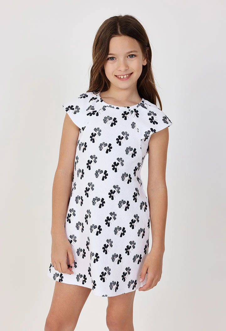 Abito in maglia per bambina con design floreale in bianco e nero.